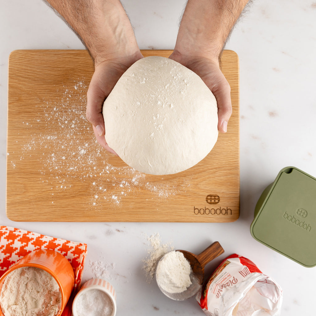 Pizza dough on a Babadoh oak board
