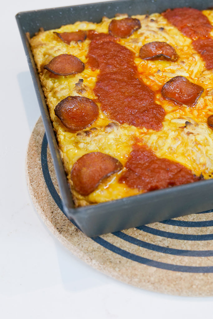 detroit style pizza topped with pepperoni