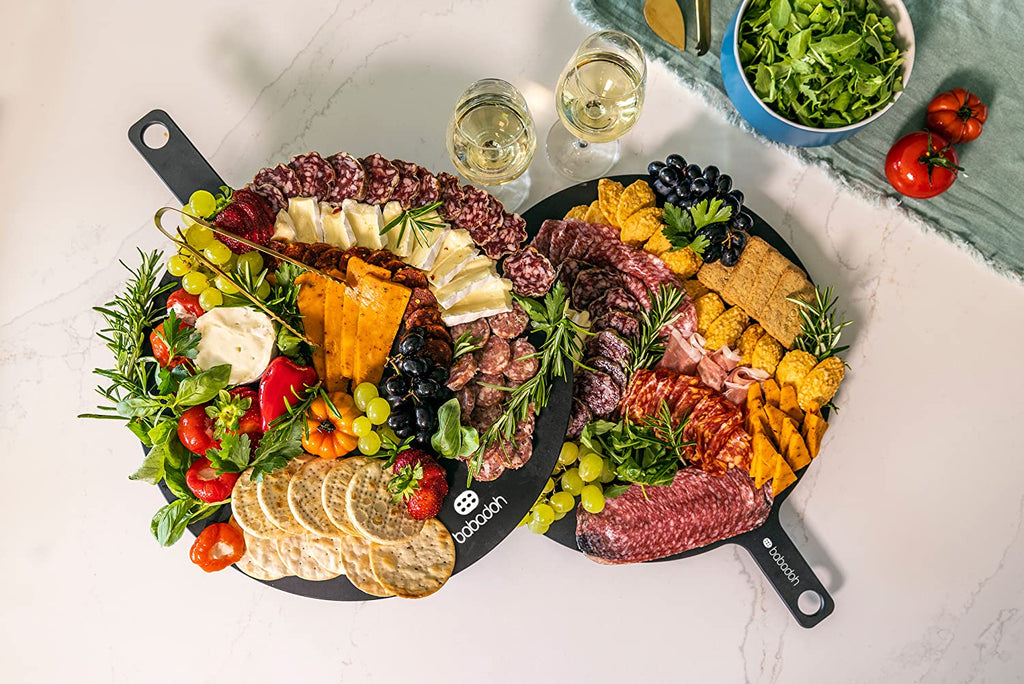 babadoh serving board with charcuterie and cheeses