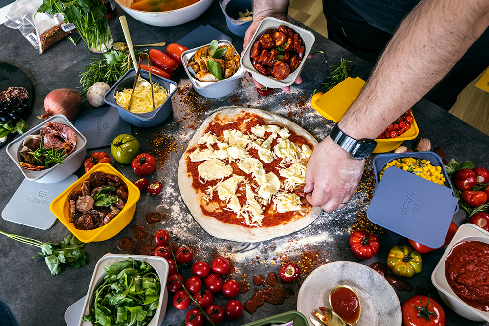 topping pizza with pepperoni